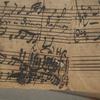 The iron-gall ink Bach used to compose the cantata has eroded the paper. 